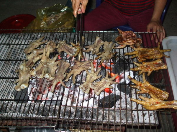 Local street stalls were cooking chickens feet