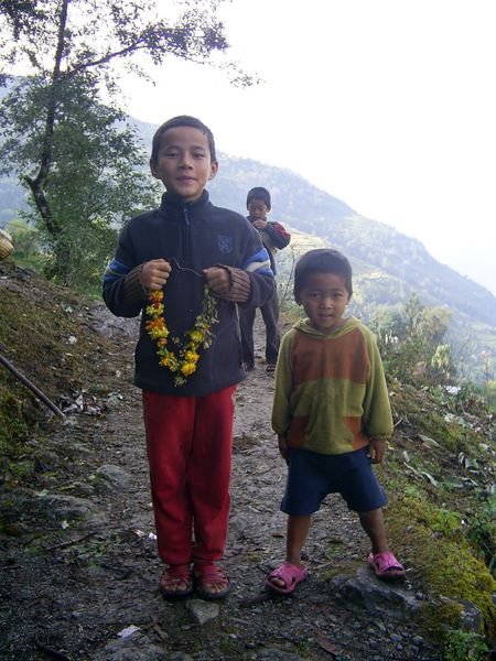 Kids with their marigold necklaces