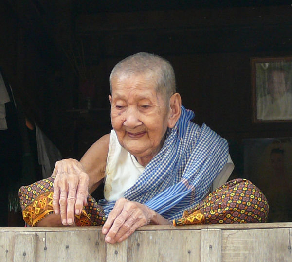 Elderly lady in the weaving village