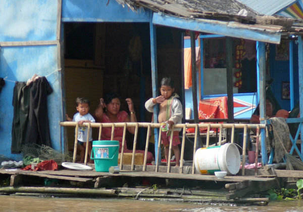Kids hanging out at home along the river