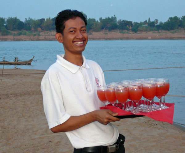 Roath serving cocktails at the sandbar party