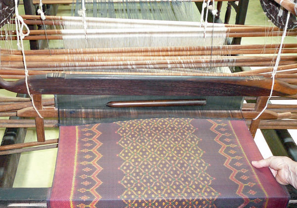 An intricate design in process on the loom