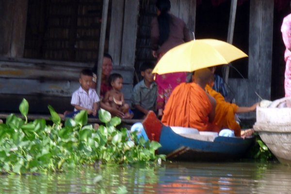 monks in boats