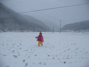 my niece in a snow field
