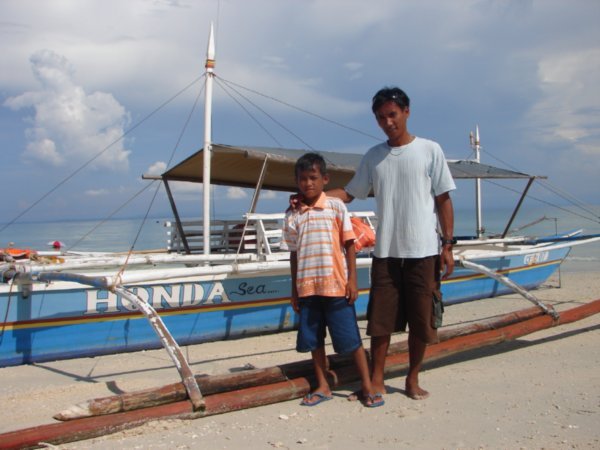 Danny with his son and boat