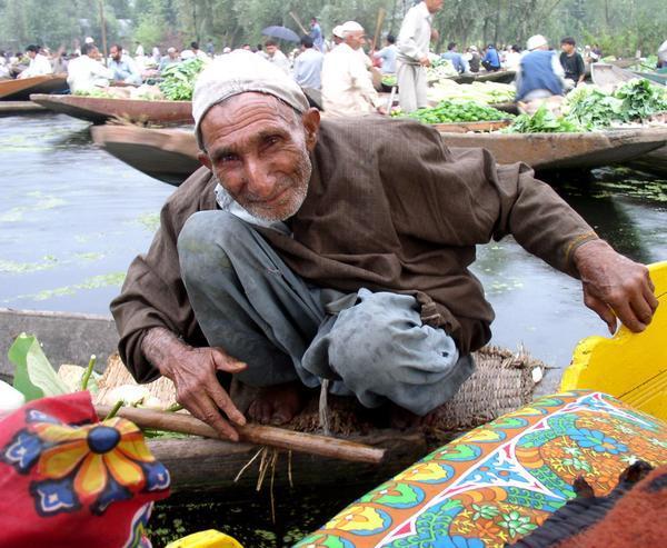 Curious vendor at the floating vegetable market, Srinigar