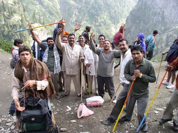 Pilgrims celebrate after reaching the top of the first pass, Yatra Amarnath Cave