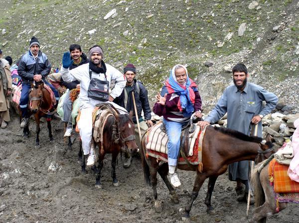 Caravan of ponies taking pilgrims up hill to the holly cave, Yatra Amarnath Cave