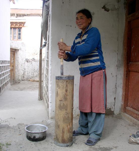 Lady of the house at Largyal Guest House making some butter tea,  Sumur