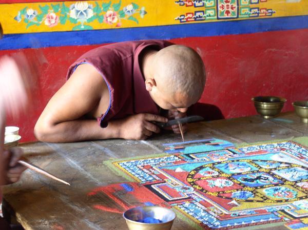 Close-up of monk making an elaborate Mandala, , Deskit Gompa