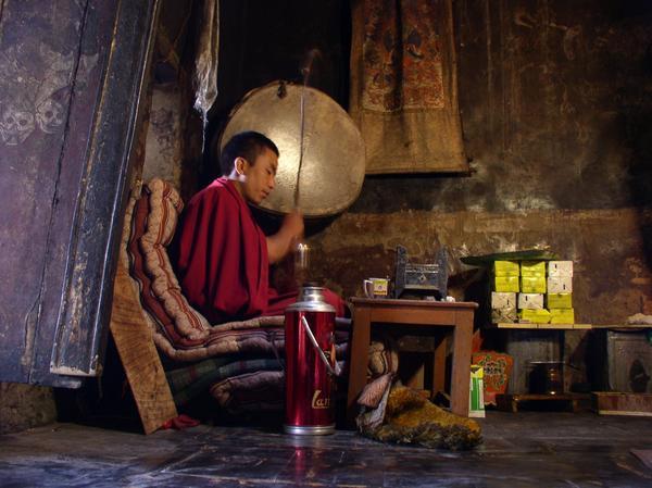 Monk perfomring the one-man puja at Thikse Gompa, Thikse