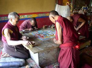 Four monks patiently making an elaborate Mandala, Deskit Gompa