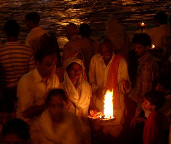 Faithful light up an offering to the Ganga, Hardiwar