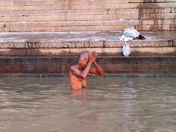 Pilgrim taking a morning bath in the the Ganga, Varanasi