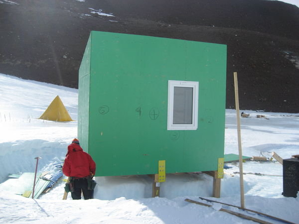 Taking down the hut... check out how deep the scoured crater was!