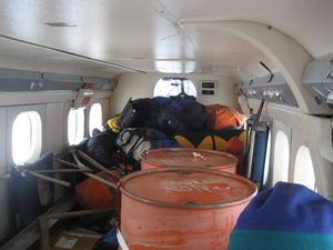 Inside the Twin Otter on the way back... retroing fuel drums of unknown contents