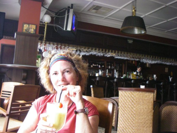 Robin sips a mango lassi in the lovely Eastern and Oriental Bar