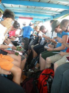 Tourists packed tight on the boat trip up the Mekong