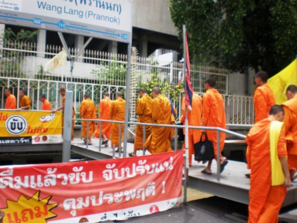 monks exit from the River Ferry