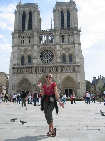 Nun in front of Notre Dame Cathedral