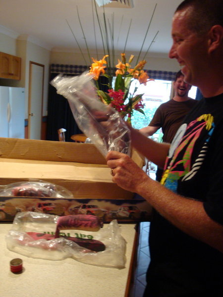 Brett getting his special delivery from Canada via Brett's parents. Some concrete trowels specially painted pink for Brett by Dave and the boys at South Fraser.