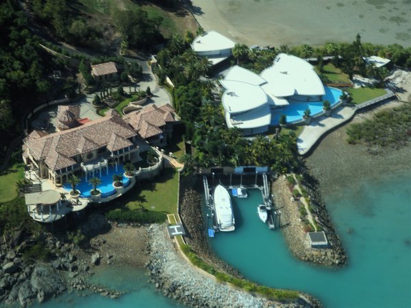 Not a bad little property! Or boat out front...Some huge houses in Airlie Beach. 
