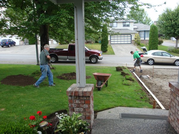 My dad and Brett working on the new driveway at my parents