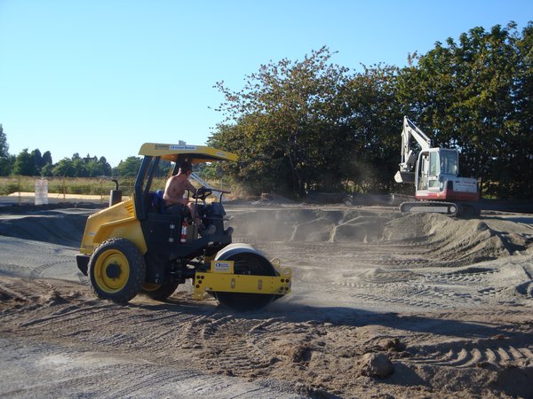 Brett in the roller, Dave in the excavator getting the park going