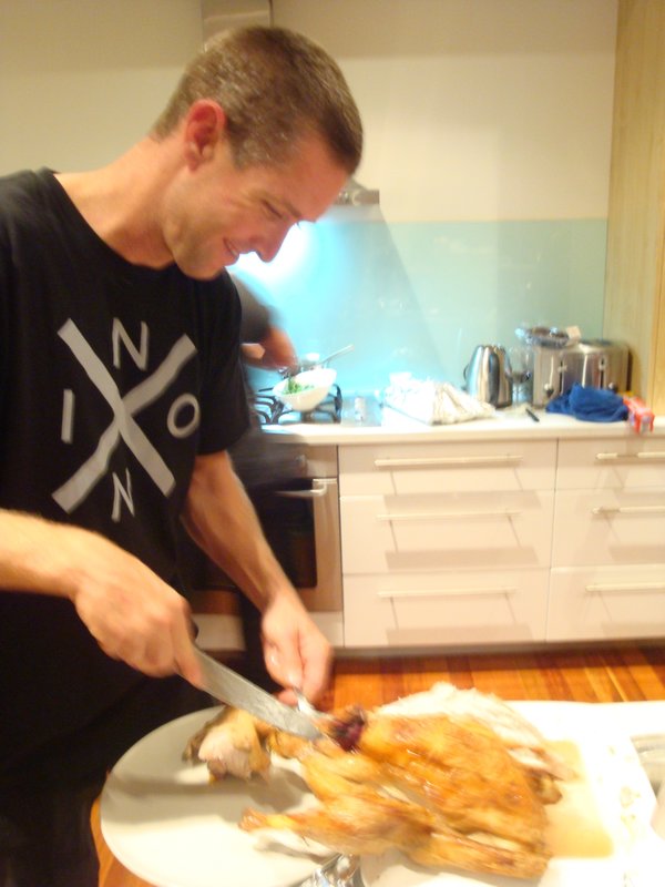 Brett carving the turkey (or more like the small chicken)