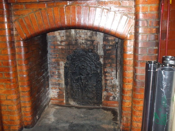 The fireplace awaits a stove