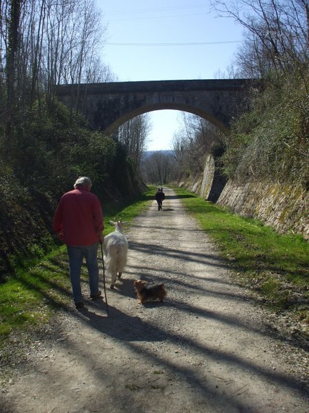 Henri, Penelope and the dog follow Valentine leading the way