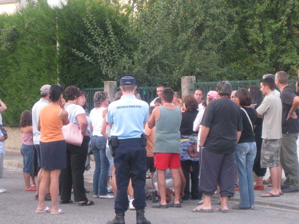 A gendarme supervises a break away group of protestors