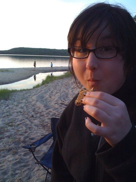 Suzanne eating a s'more