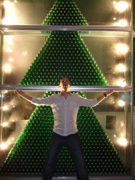 Paul trying to drink a Christmas Tree made of Heineken