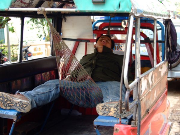 Tuktuk driver taking a nap