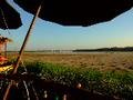 Having a beer by the Mekong