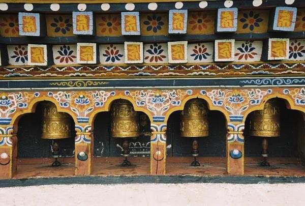 Spiffy golden prayer wheels at Chimi Lhakang