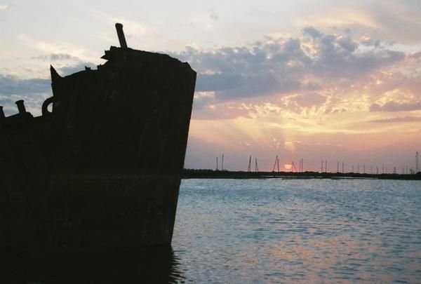 Sun sets on an old hull
