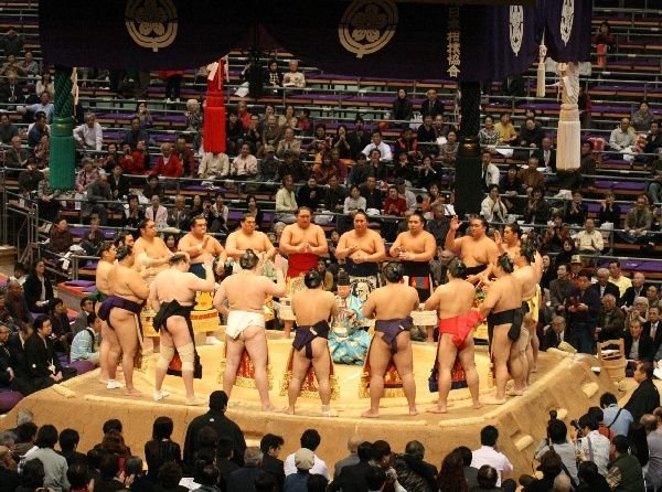 Nishi rikishi of the makuuchi division perform the ring entering ceremony