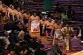 Higashi rikishi of the juryo division arrive for the ring-entering ceremony
