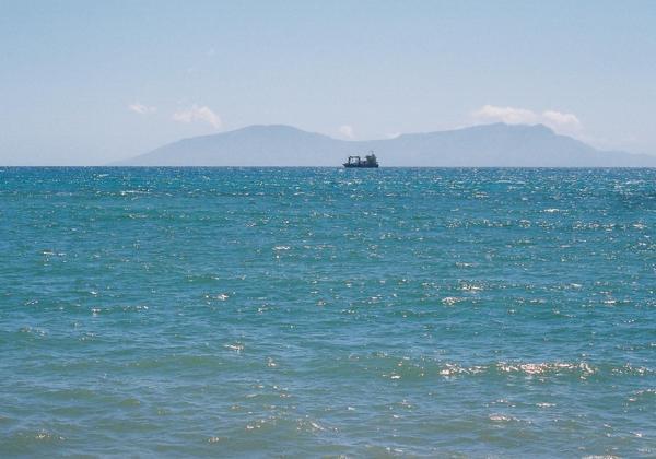 Atauro Island fronted by a container vessel
