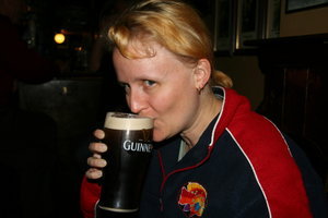 Emma sampling a Guinness at the Brazen Head