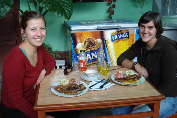 Jore and I eating a cuy [guinea pig], the Peruvian specialty