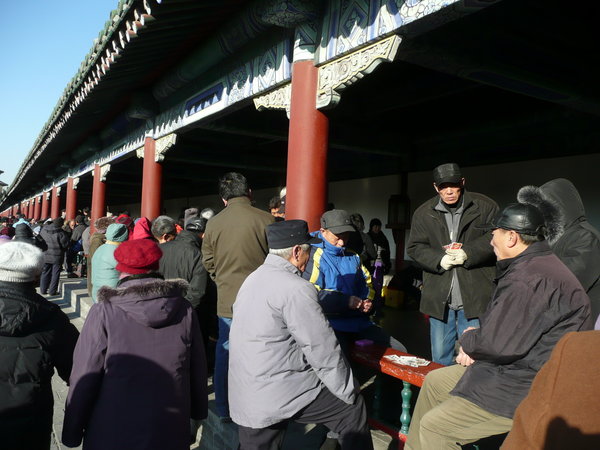 Beijingers enjoying a game of cards, temple of heaven