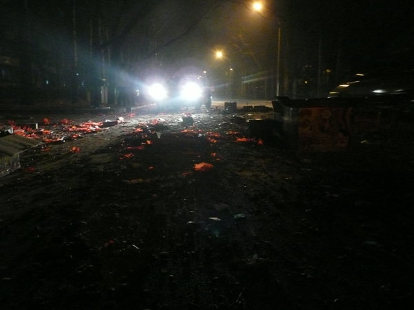 The streets of Beijing strewn with spent firework debris