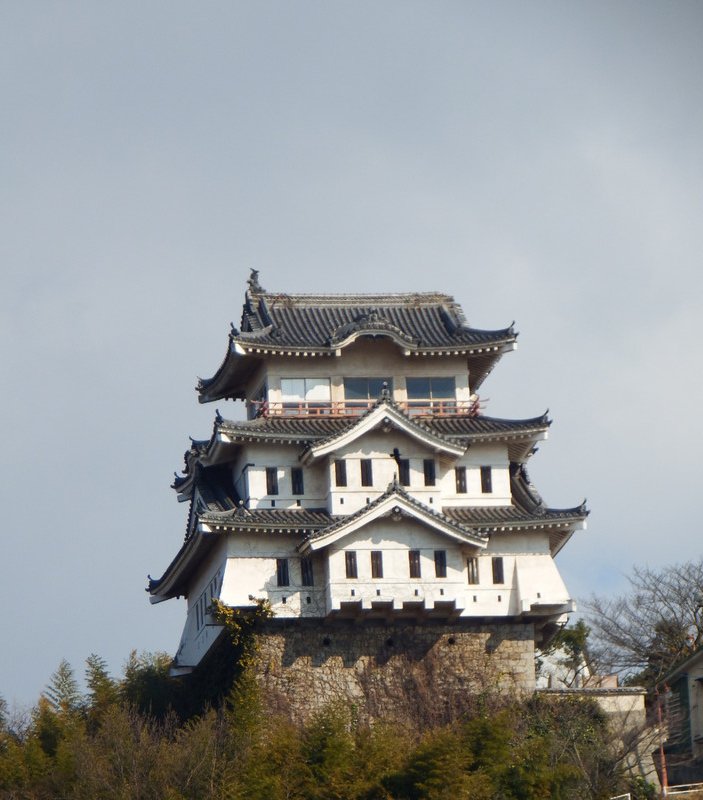 Onomichi castle peers over the Port