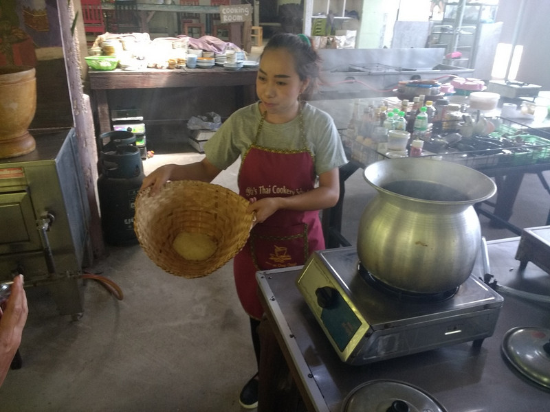 Steaming Rice in a basket at cooking class
