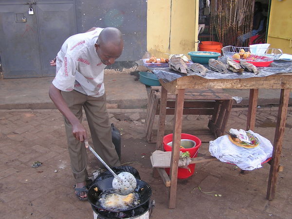 Man frying Cassava in the market