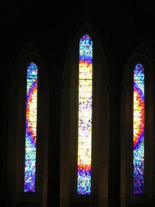 A stain glass window representing the cosmic nature of Christ