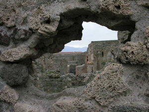 A view of the ruins through a ruined wall